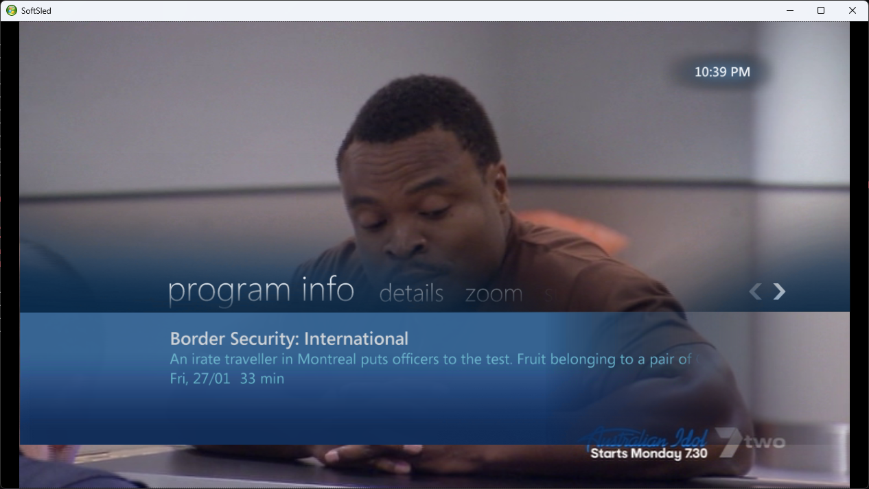 Live TV playback with translucent program-info overlay